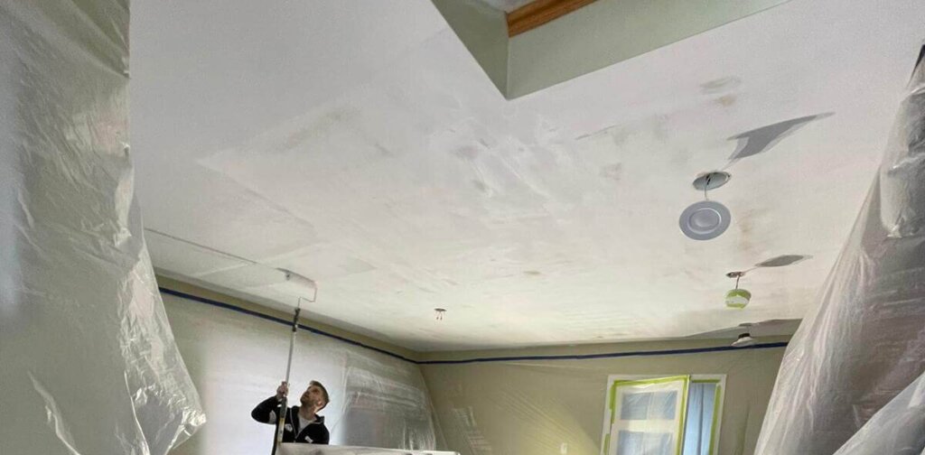 Professional painters from MS Painting doing popcorn ceiling removal