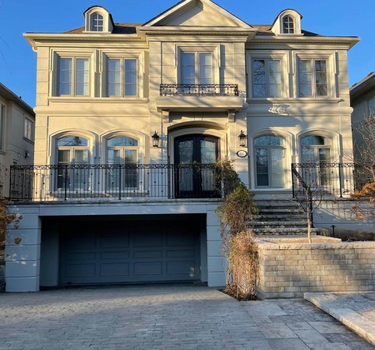 A big house and driveway. Exterior painting done on the house by expert exterior painters Toronto