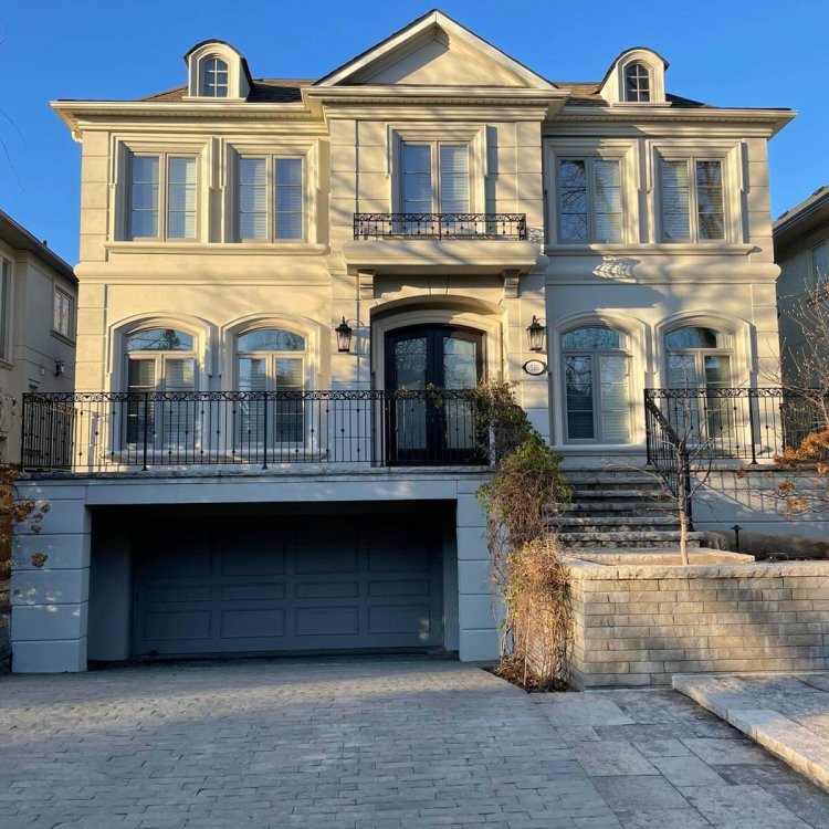 A big house and driveway. Exterior painting done on the house by expert exterior painters Toronto