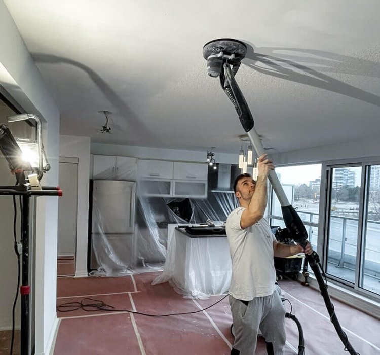 Popcorn remover doing dustless popcorn ceiling removal